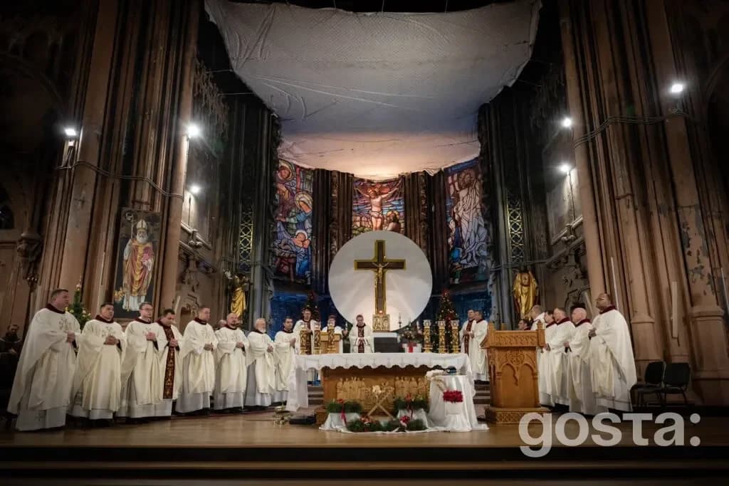 Alt text: "Clerics in white robes perform a mass at St. Nicholas Church, celebrating interfaith unity in Ukraine.