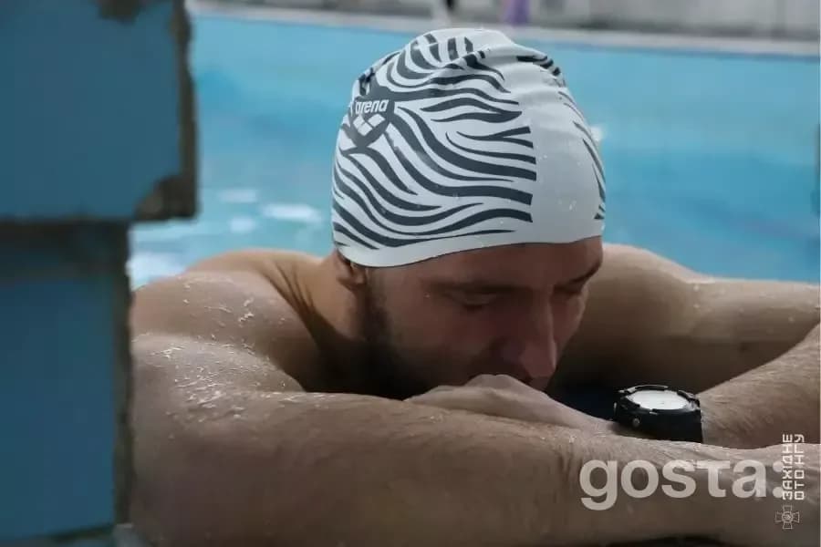 Alt text: "Veteran swimmer recovering at a competition in Lviv, showcasing resilience and dedication in rehabilitation.