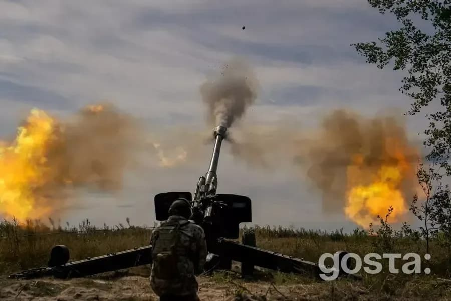 Artillery crew fires a cannon, showcasing the strength of Ukraine's National Guard in defence operations.