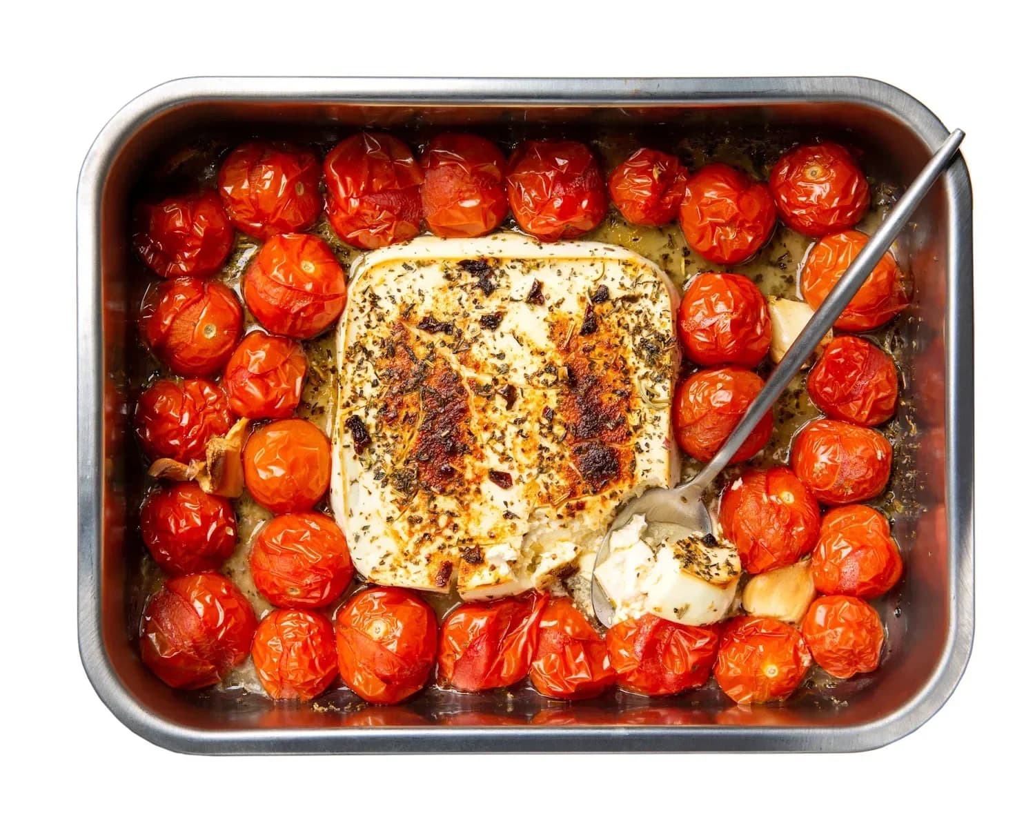Baked feta pasta with cherry tomatoes in a casserole dish