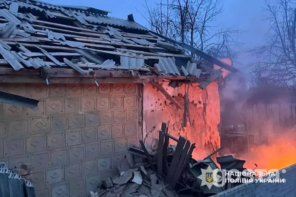 Destruction from a Russian missile strike in Kyiv, showing damaged buildings and emergency response efforts.
