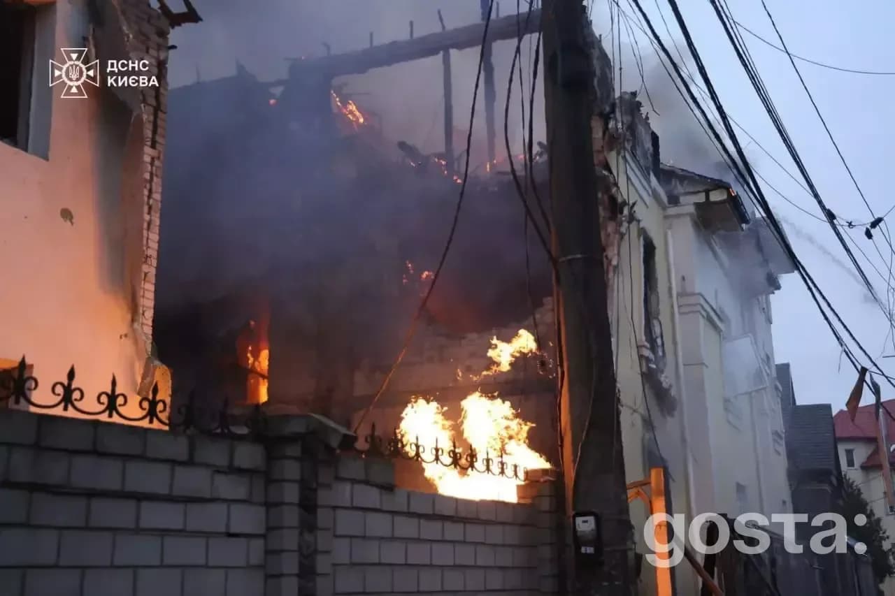 Emergency responders extinguish fires and assess damage from a Russian missile attack in Kyiv, December 27, 2025.