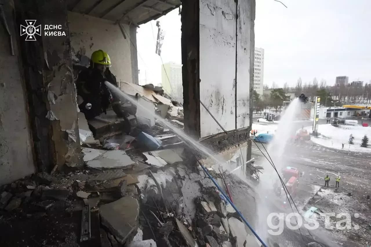 Emergency responders from Ukraine's State Emergency Service combat fires following a Russian attack in Kyiv.