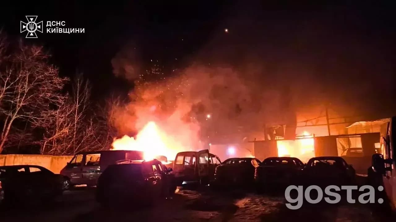 Emergency responders tackle fires after a Russian attack in Kyiv, illustrating the aftermath of the devastating assault.