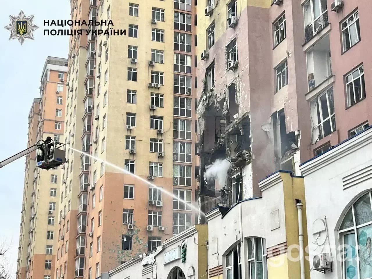 Emergency responders tackle the aftermath of a Russian attack in Kyiv, addressing fires and damage to residential buildi