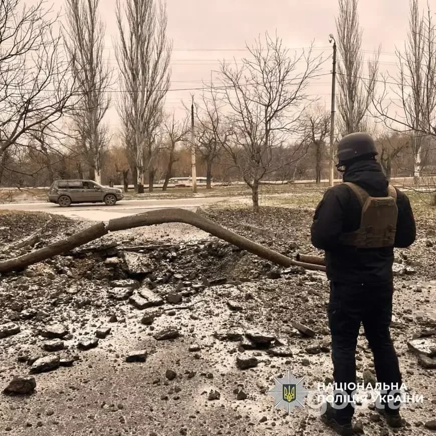Emergency response officer surveys damage from missile strikes in eastern Ukraine, highlighting the impact of military c