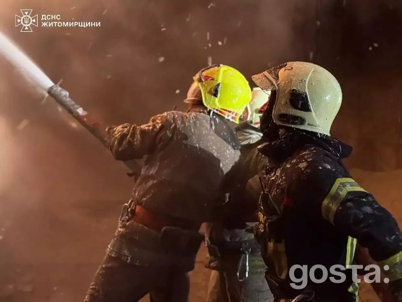 Firefighters combat an intense blaze at night caused by drone strikes in Ukraine, highlighting the ongoing conflict's im