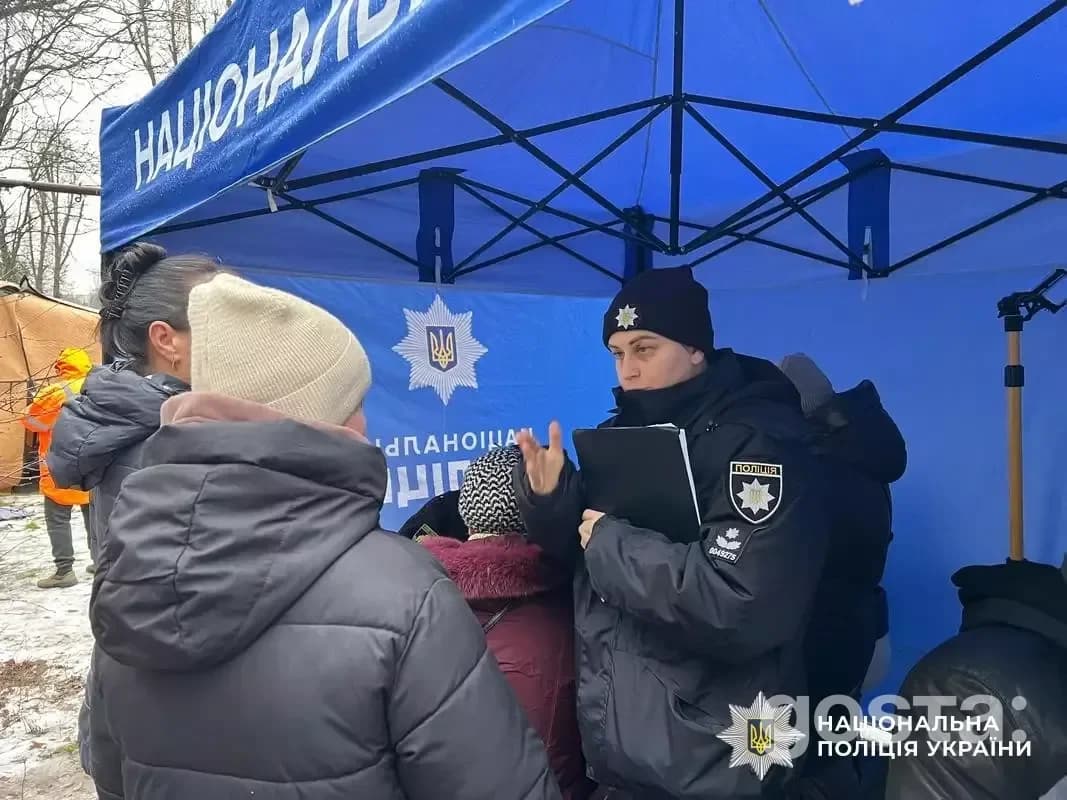 Rescue workers assist civilians in Dnipro following a nighttime attack, providing support and assessing damage.