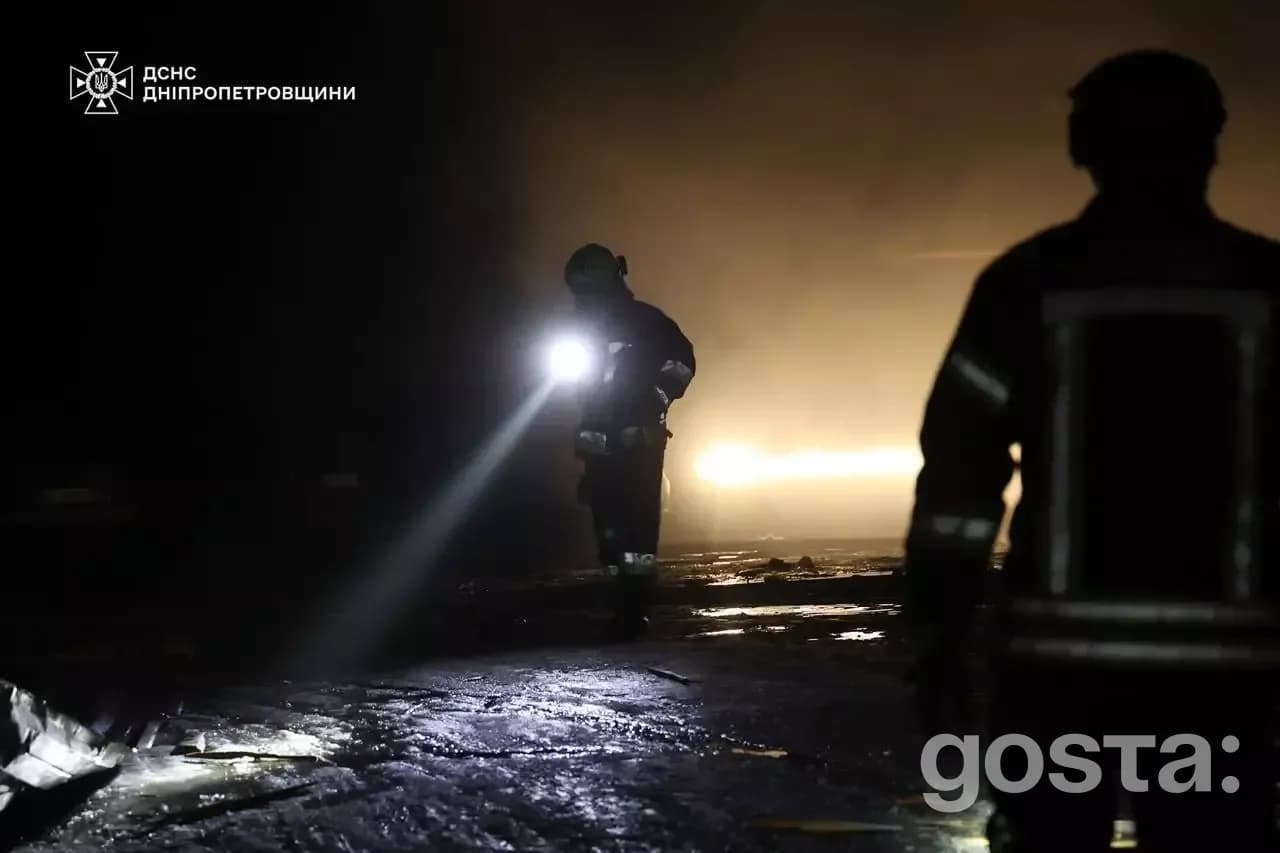 Rescue workers from Ukraine’s State Emergency Service respond to fires after a nighttime attack on Dnipro, aiding the in