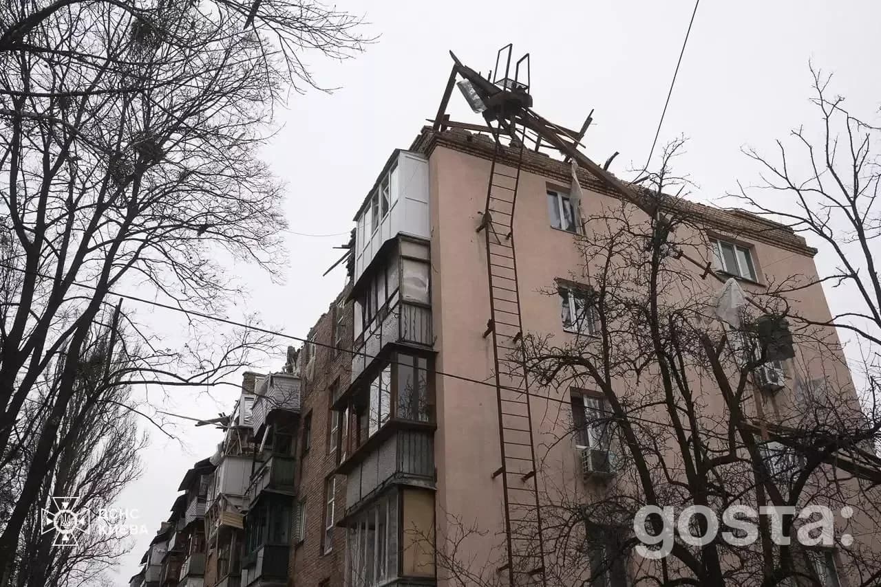 Residential building damage in Kyiv after Russian attacks, showcasing emergency response efforts by rescuers.