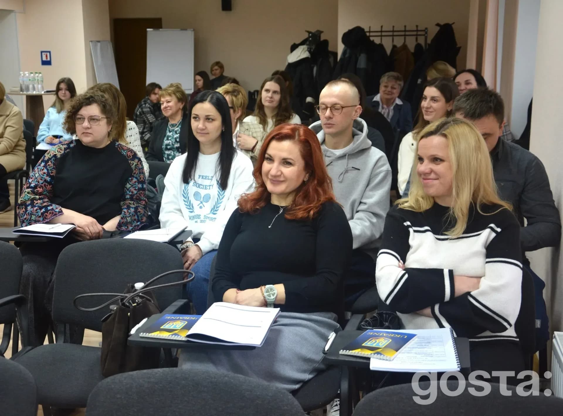 Seminar on regulatory strategies for drug development, featuring experts, participants engaged in discussions and traini