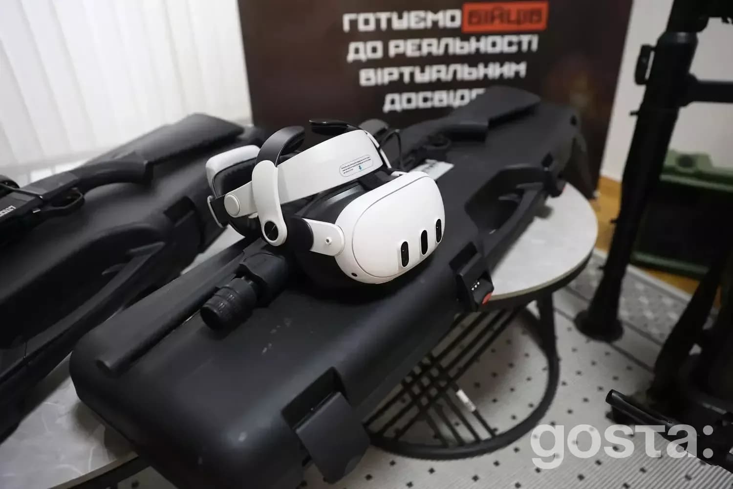 VR headset on table with tactical gear, representing innovative research in law enforcement education at MVS meeting.